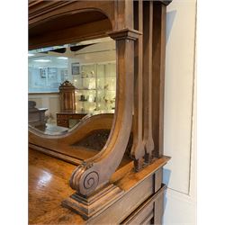 Late 19th century Arts & Crafts period oak mirror back sideboard, shaped bevelled mirror back carved with foliate scrolls and flower heads, down swept supports with elongated club-shaped uprights, moulded rectangular top over two drawers and three cupboards, the drawer fronts with copper handles decorated with sailing ships, panelled doors carved with mythical beasts, flowerheads and foliage, on moulded block feet
