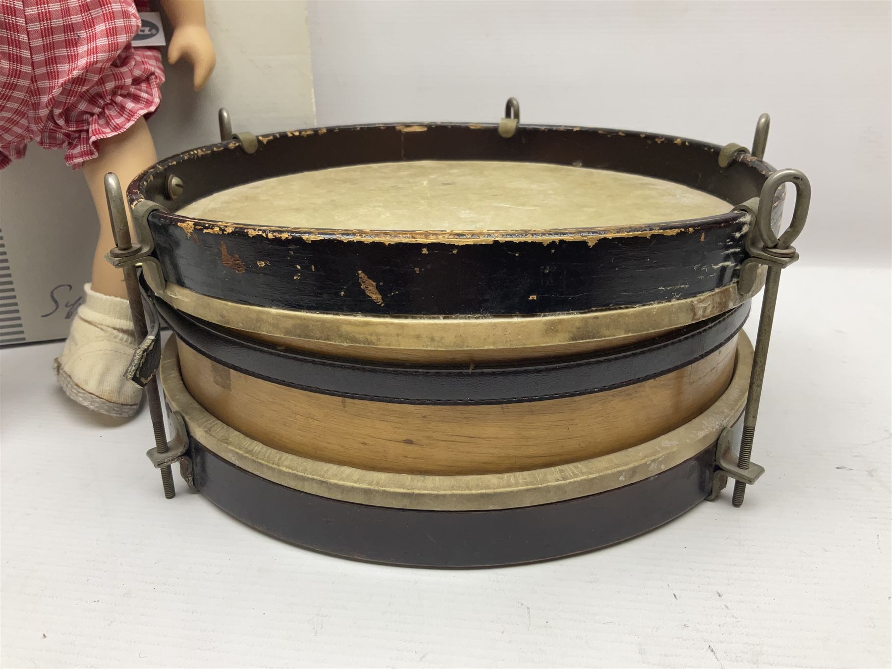 German Gotz articulated vinyl baby doll 'Claire' c1997 with original clothing, hat and labels; artist designed by Sylvia Natterer H35cm; boxed; and small child's wooden cased drum (2)