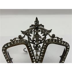 Early 19th century silver plated double photograph frame, each rounded rectangular aperture surrounded by a paste border, with ornate scroll feet and mantling also set with clear paste stones, with easel style support verso, H12cm