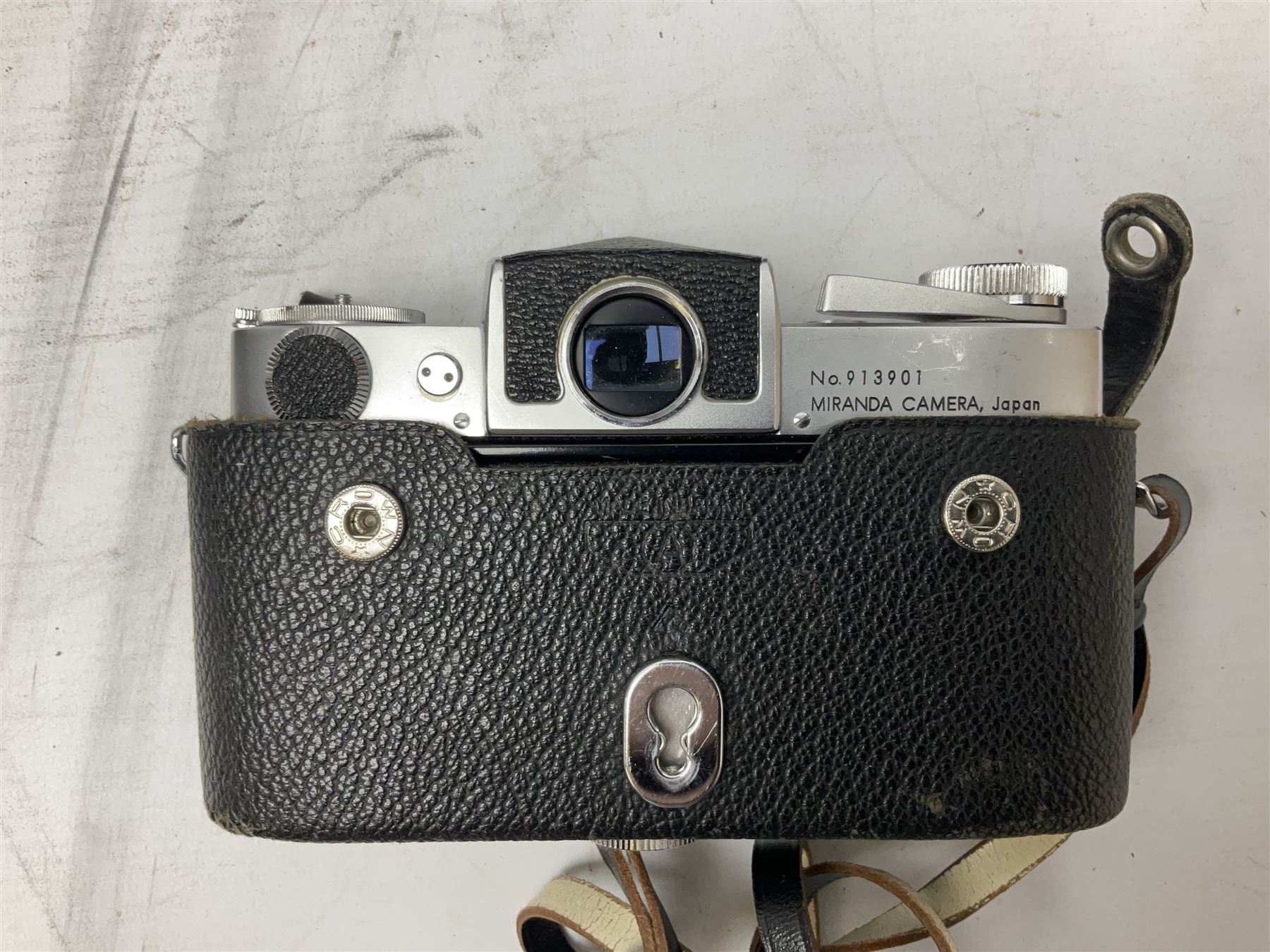 Miranda Sensorex camera body, Miranda Sensorex II camera body with 'Auto Miranda 1:1.8 f-59mm' lens, 'Auto Miranda 1:2.8 f-135mm' lens, 'Auto Miranda 1:3.5 f-200mm' lens, 'Auto Miranda 1:2.8 f-28mm' len, Agfa plate camera with 9cm x 12cm plates and other camera equipment including Miranda camera bag