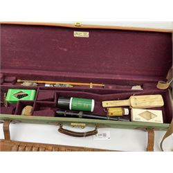 Brady leather mounted canvas shotgun case, the fitted interior to accommodate 71cm barrels, containing telescopic sight, bird scarer and assorted cleaning equipment L78.5cm; together with two canvas gun sleeves; and leather cartridge belt (4)