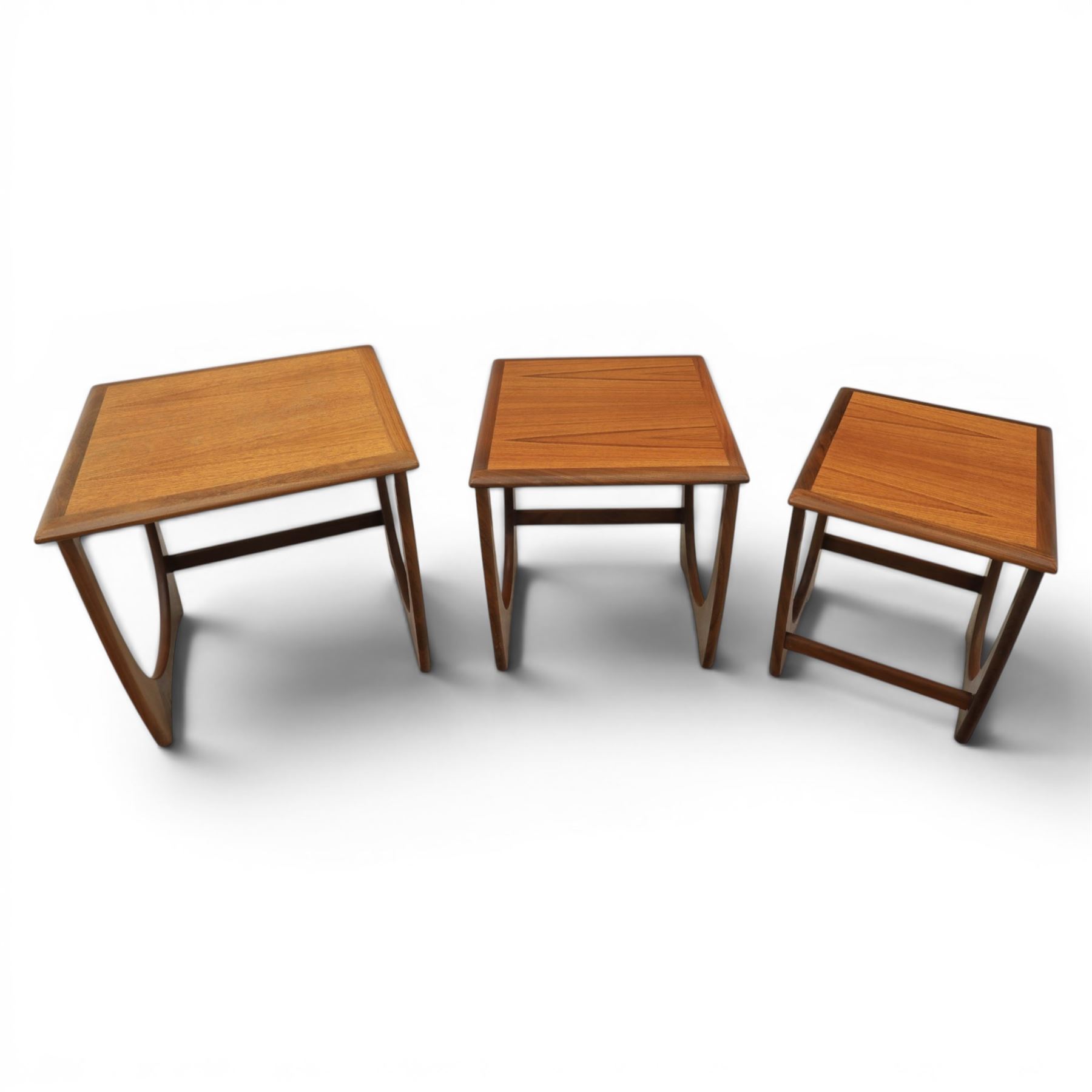G-Plan - 'Astro' teak nest of three tables, square top with shaped supports