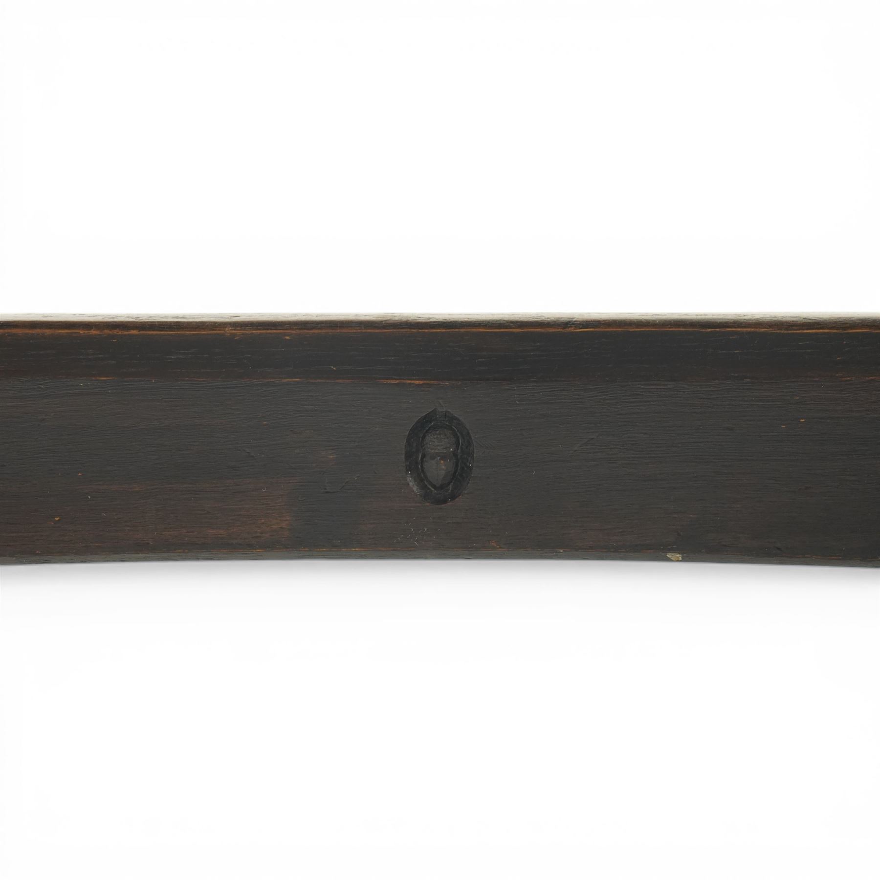 Acornman - dark stained oak dining table, rectangular top raised wishbone end supports united by stretcher, with carved acorn signature, by the workshop of Alan Grainger of Brandsby