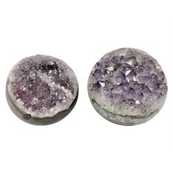 Pair of amethyst geode spheres, with purple crystalline internal formations, D9cm