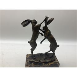 Bronze figure group, modelled as two male hares boxing, upon a naturalistic base, after 'Nick', with foundry mark, raised upon a rectangular base, H24cm