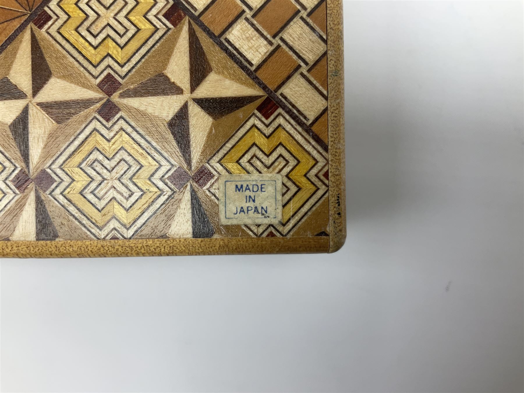 Japanese parquetry puzzle box L12cm; another Japanese puzzle box with marquetry top of Mount Fuji; eleven graduated Chinese figures including immortals; and Chinese figure of a lady standing on a hardwood base next to a horn table (14)