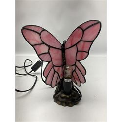 Two Tiffany style lamps, one in the form of a woman with butterfly wings, the other with a floral leaded shade, tallest H33cm