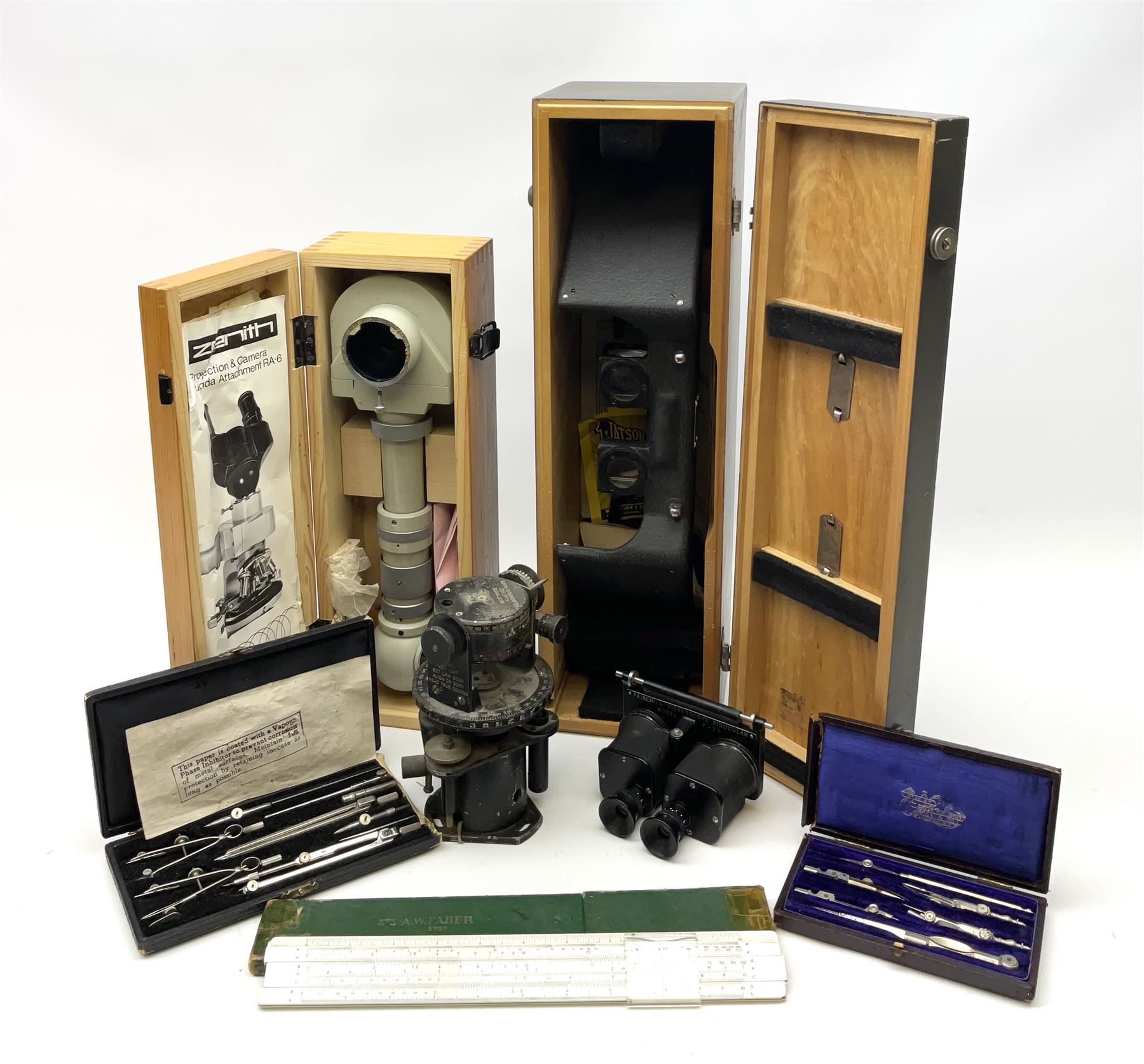 WW2 American Fairchild F-71 binocular magnifying telescope, in green painted wooden carrying box with instruction leaflet L48cm; WW2 Air Ministry Astro Compass Mk.II Ref. 6A/1174(0); Zenith Projection & Camera Lucida Attachment RA-6, boxed with instructions and 1977 purchase invoice; two cased sets of drawing instruments; and a boxed Faber slide rule (6)