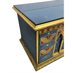 In the manner of William Burges - mid-to-late 19th century English Gothic Revival pine altar or console table, in blue and red paint with water gilding, the moulded rectangular top over six pointed arches with turned column supports, the front carved with a single row of lozenges and incised stylised motifs