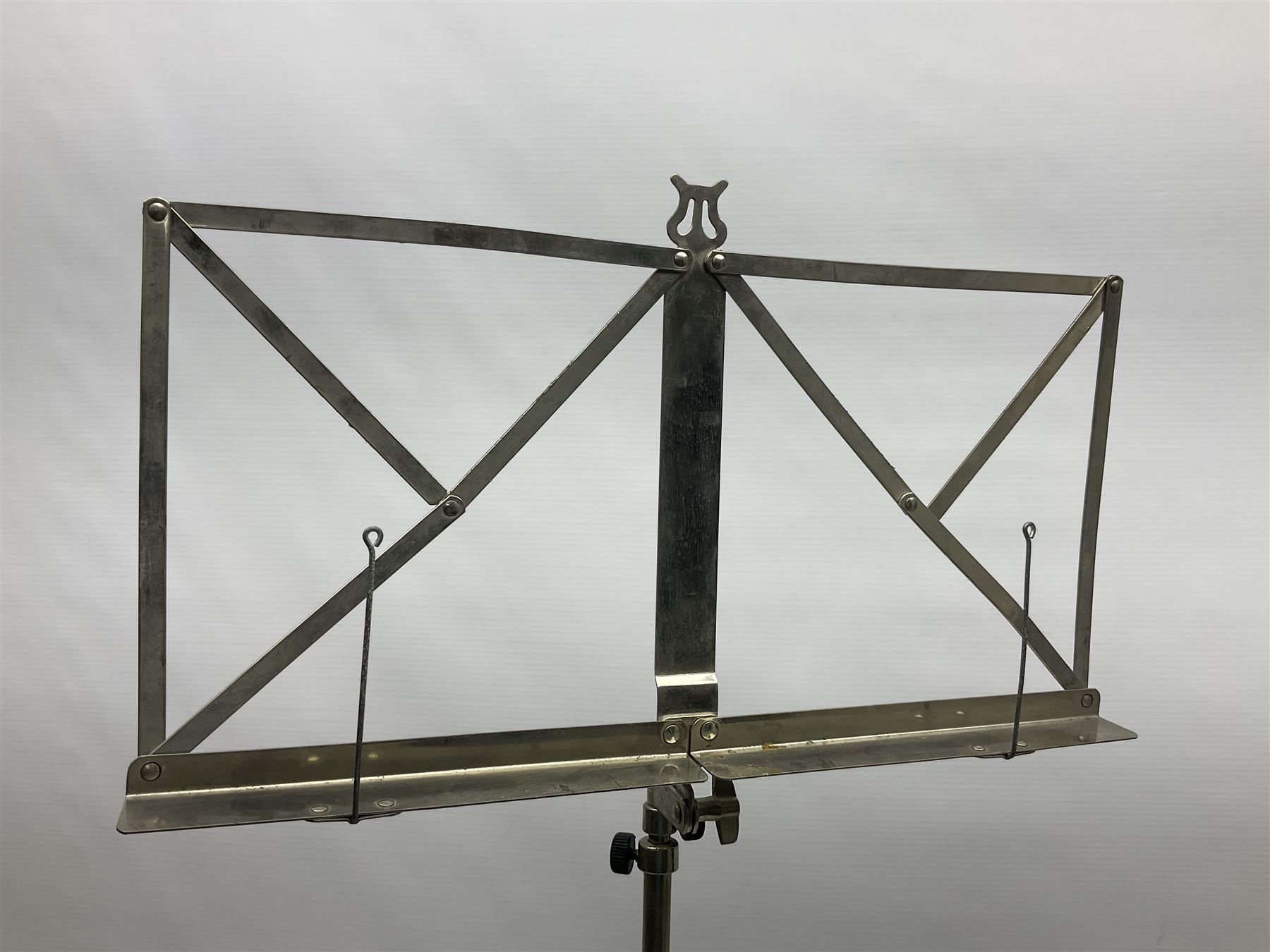 Late 19th/early 20th century Italian lute back mandolin with segmented back and spruce top; bears maker's label for Pietro Tonelli Napoli; together with a mandolin instruction booklet and a folding music stand L60.5cm