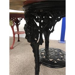 Pair cast iron Britannia pub tables, one red, one black with large marble tops 