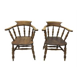 Pair of captains smokers bow chairs, spindle tub shaped back and saddle seat, raised on turned supports united by double H stretcher