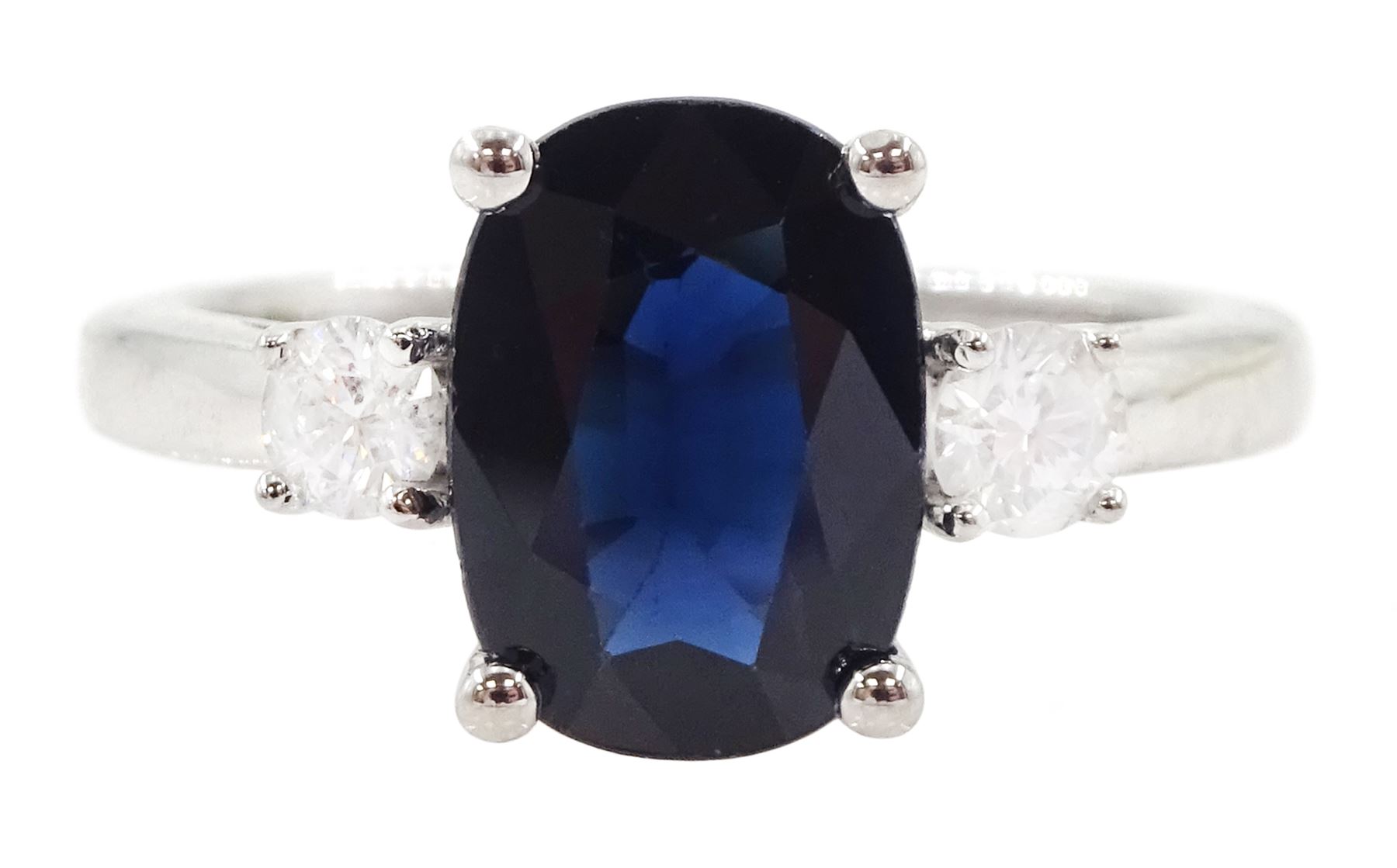 18ct white gold three stone oval cut sapphire and round brilliant cut diamond ring, hallmarked, sapphire approx 2.60 carat, total diamond weight approx 0.25 carat