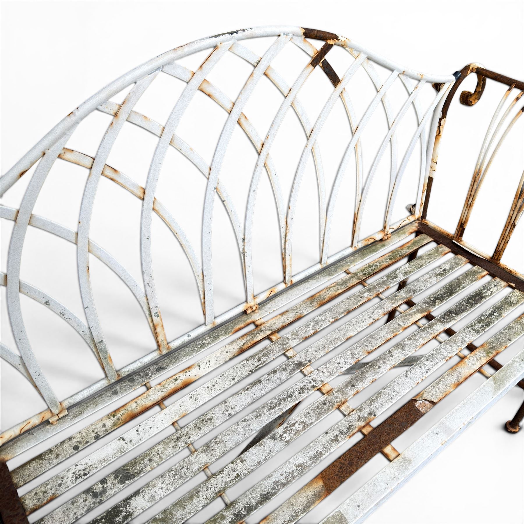 Small wrought metal two seat garden bench, finished in distressed white paint
