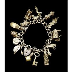 Silver charm bracelet, charms including articulated cat in bin, car, Yorkshire rose, boot and soda siphon