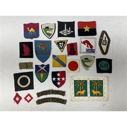 Approximately one-hundred printed and embroidered cloth badges including Royal Tank Regiment, Royal Armoured Corps, 219th Independent Infantry Brigade, Cyrenaica, Cyprus, Singapore and other districts, Gibraltar Garrison, East Anglian Brigade, 20th Armoured Brigade and various armoured divisions etc