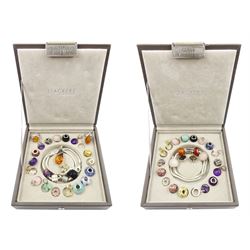 Two silver Baltic amber rings and a silver Baltic amber pendant, two snake link necklaces and forty-seven silver stone set charms including opal fairy, agate, amethyst and rose quartz charms, in two Stackers leather charm boxes