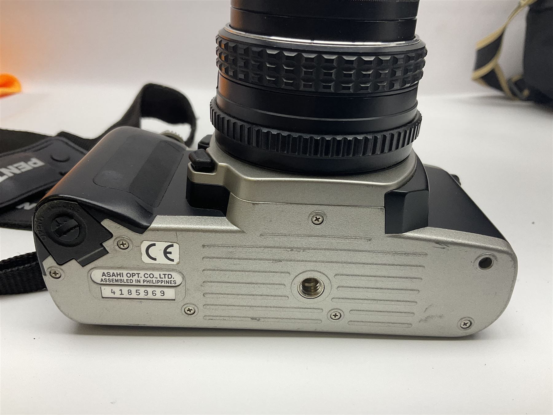 Four camera bodies, to include, Ricoh KR-10 serial no. 38826, Pentax MZ-M serial no. 4185969 with 'SMC Pentax- M 1:3.5 28mm' lens, Canon EOS500 serial no. 080927, with 'Sigma Zoom 100-300mm 1:4.5-6.7 DL'  lens etc, with other camera lenses and equipment 