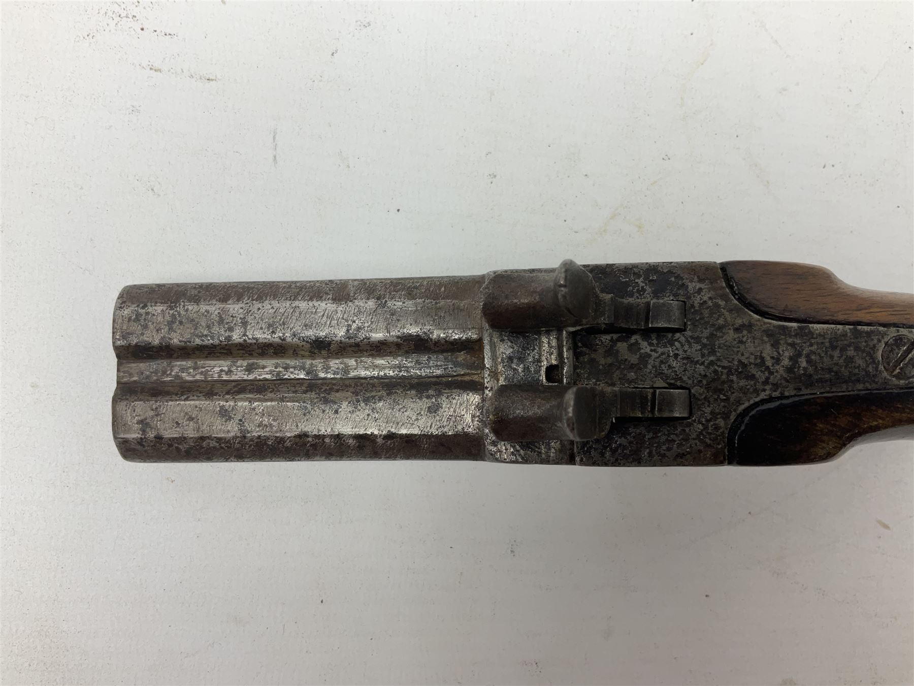 Mid 19th century double barrel percussion muff pistol, joined 7cm octagonal barrels with walnut stock19cm overall; a matching single barrel muff pistol 17cm overall (2)