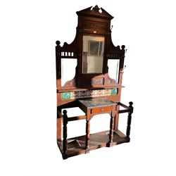 Edwardian oak hallstand, shaped pediment with egg and dart cornice and carved panelled frieze, bevelled mirror above shelf, the lower section with tiled back over marble-topped single drawer, turned supports joined by an undertier with fitted umbrella stands