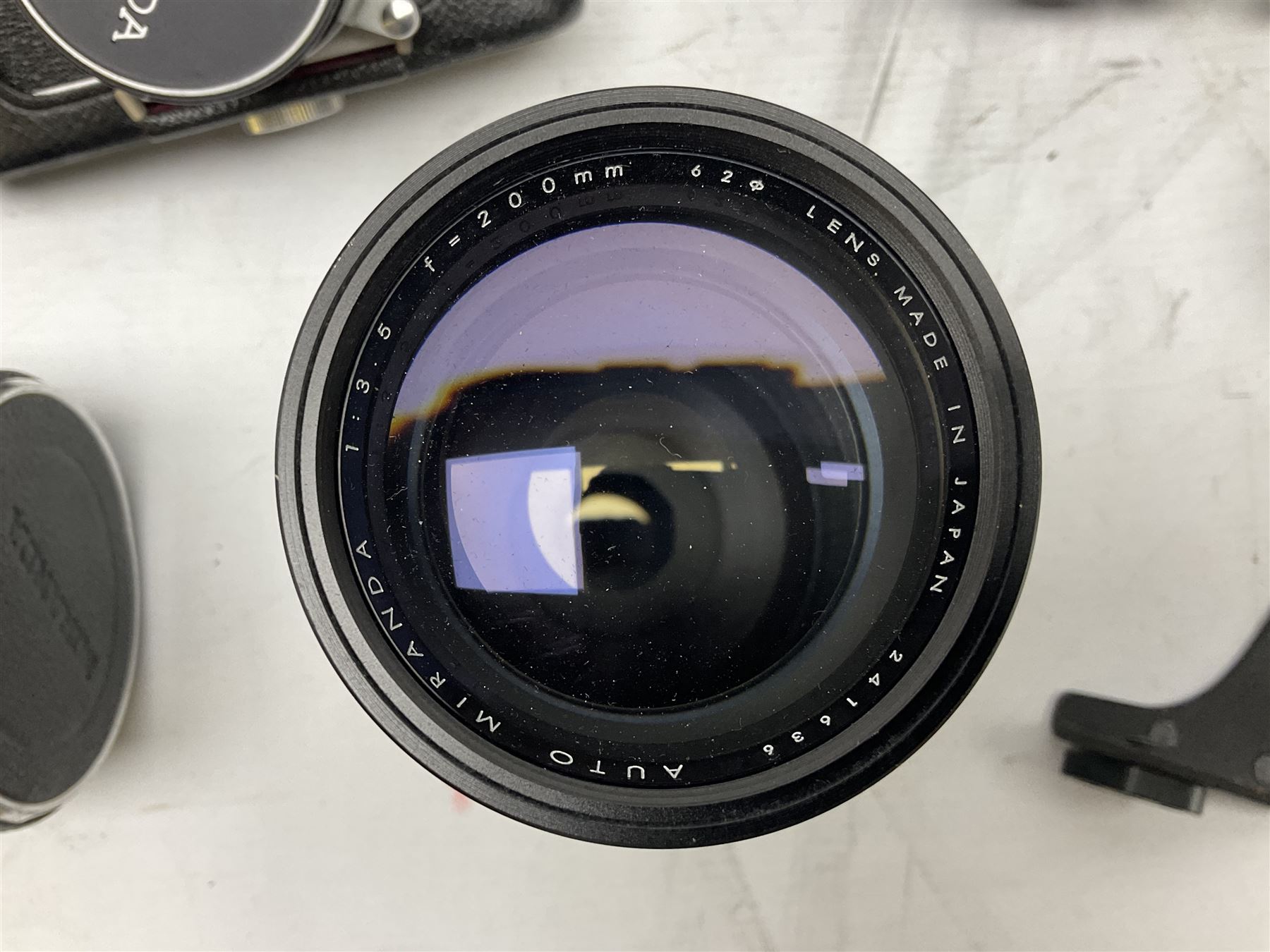 Miranda Sensorex camera body, Miranda Sensorex II camera body with 'Auto Miranda 1:1.8 f-59mm' lens, 'Auto Miranda 1:2.8 f-135mm' lens, 'Auto Miranda 1:3.5 f-200mm' lens, 'Auto Miranda 1:2.8 f-28mm' len, Agfa plate camera with 9cm x 12cm plates and other camera equipment including Miranda camera bag