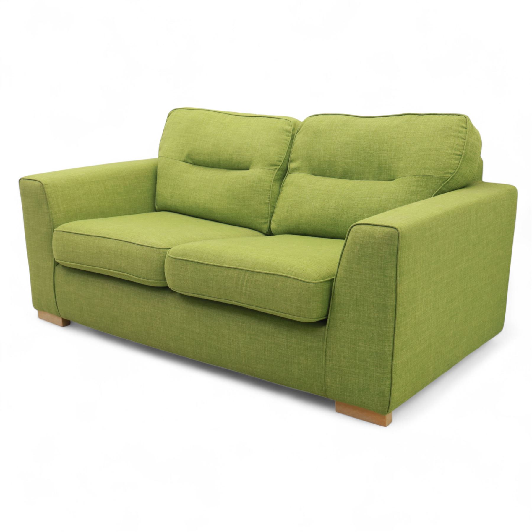 Contemporary lime green upholstered sofa bed, with rectangular arms and two seat cushions, the back with two stitched backrest cushions, on low block feet