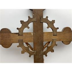 Oak crucifix carved with flowers, the cross mounted with bronzed metal depiction of Christ, L90cm