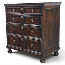 Late 17th century moulded front oak chest of drawers, rectangular plank top. above two banks of four graduated drawers, central escutcheons and drop handles, on squat bun feet