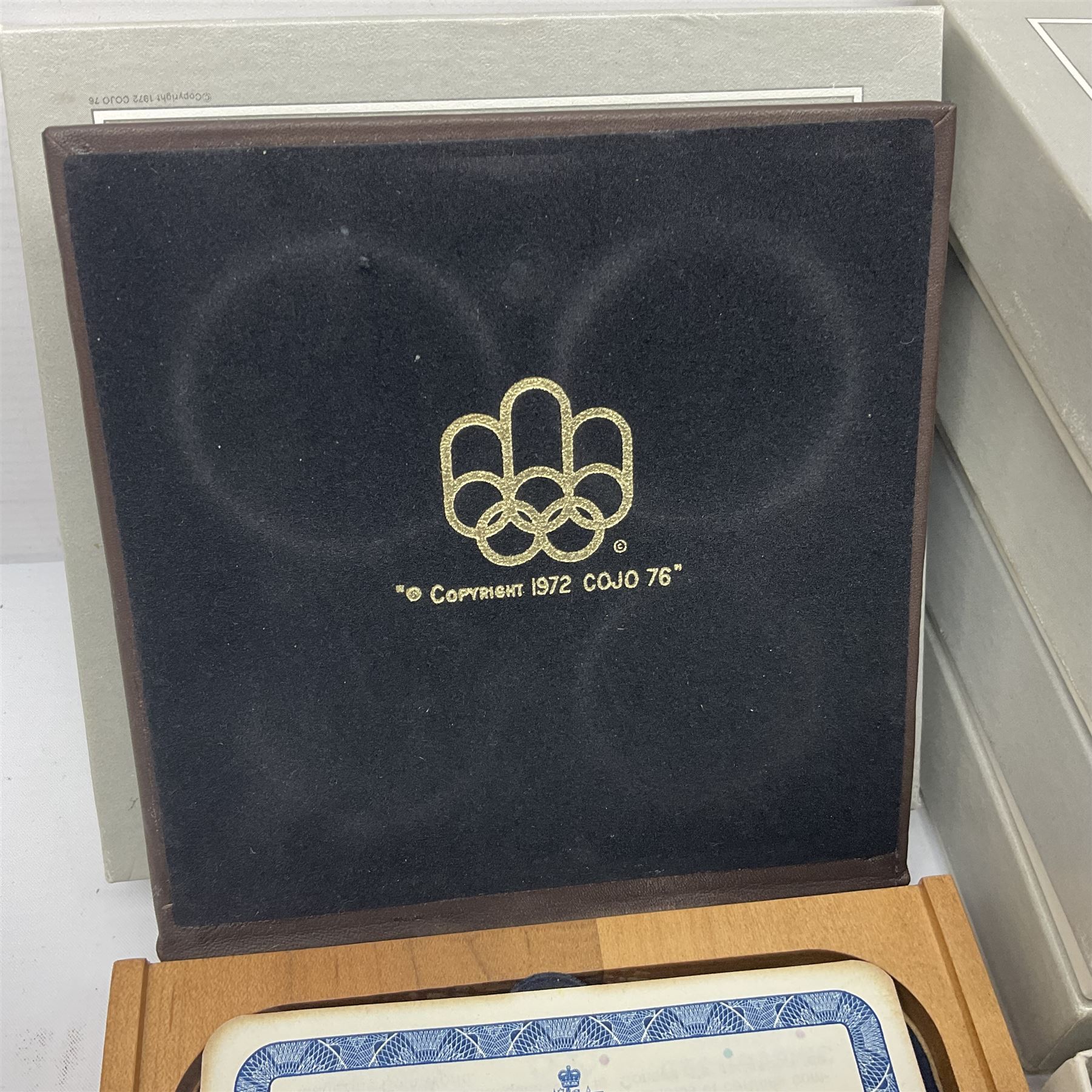 Six Queen Elizabeth II The Royal Canadian Mint silver proof four coin sets, to commemorate the 1976 Montreal Olympic Games, each set containing two five dollar coins and two ten dollar coin with Queen's head obverse and designs to the reverse relating to the Olympic Games, all in the original display cases and outer card boxes with certificates