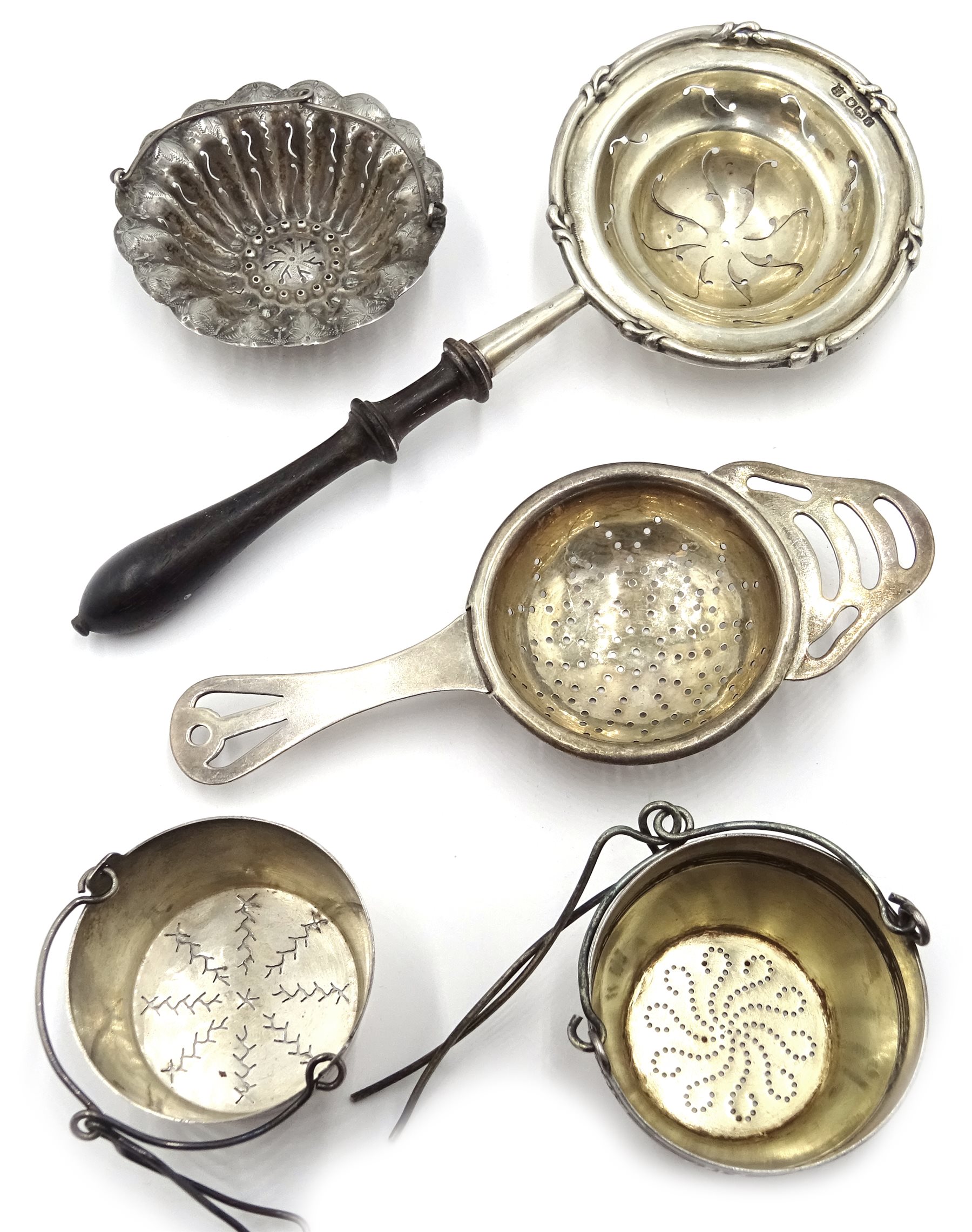 French silver tea strainer by Armand Fresnais Paris and a similar