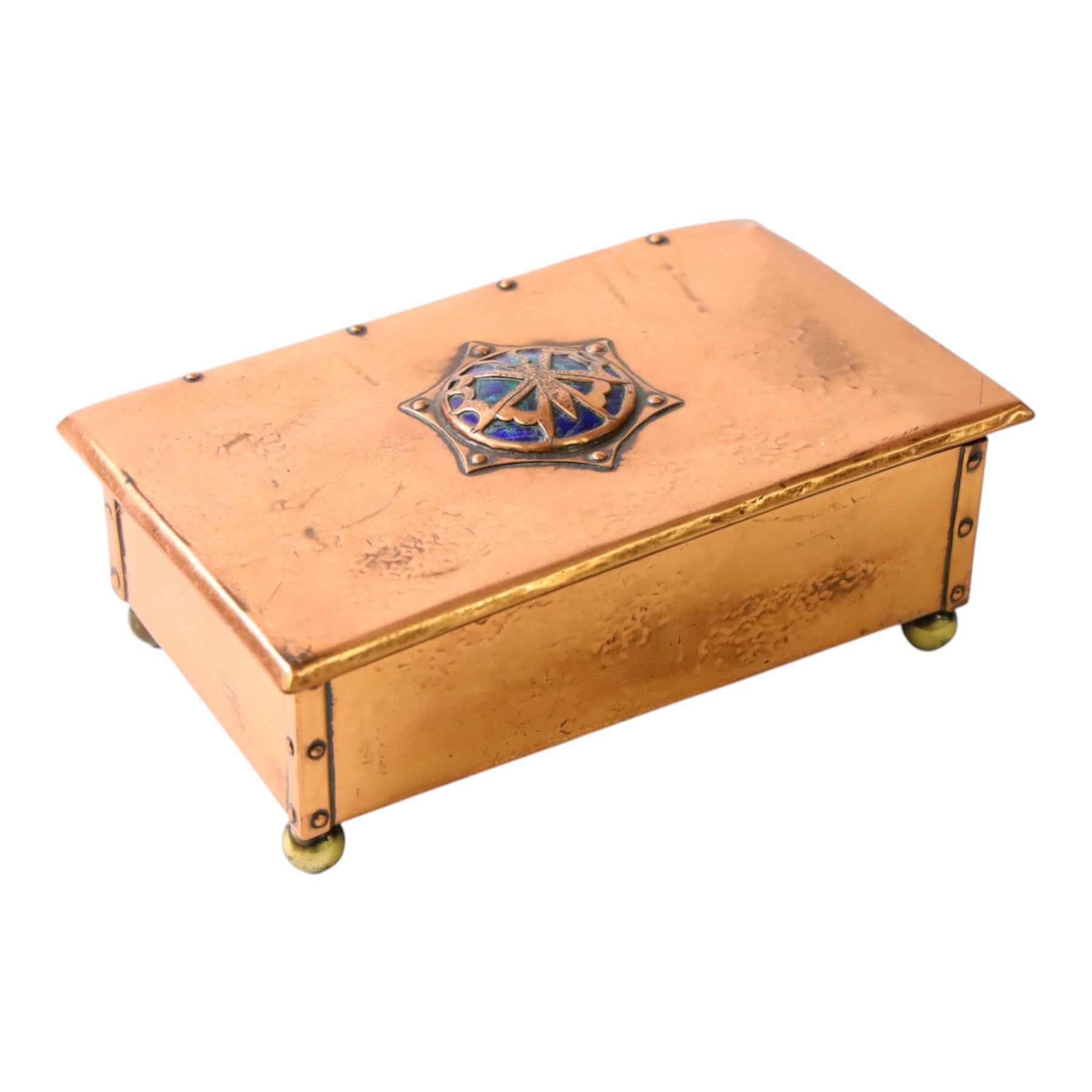  Arts & Crafts copper and enamel box, of rectangular form, the hinged lid with central enamel cabochon overlaid with pierced copper butterfly motif, raised on brass bun feet, H7cm, L17cm