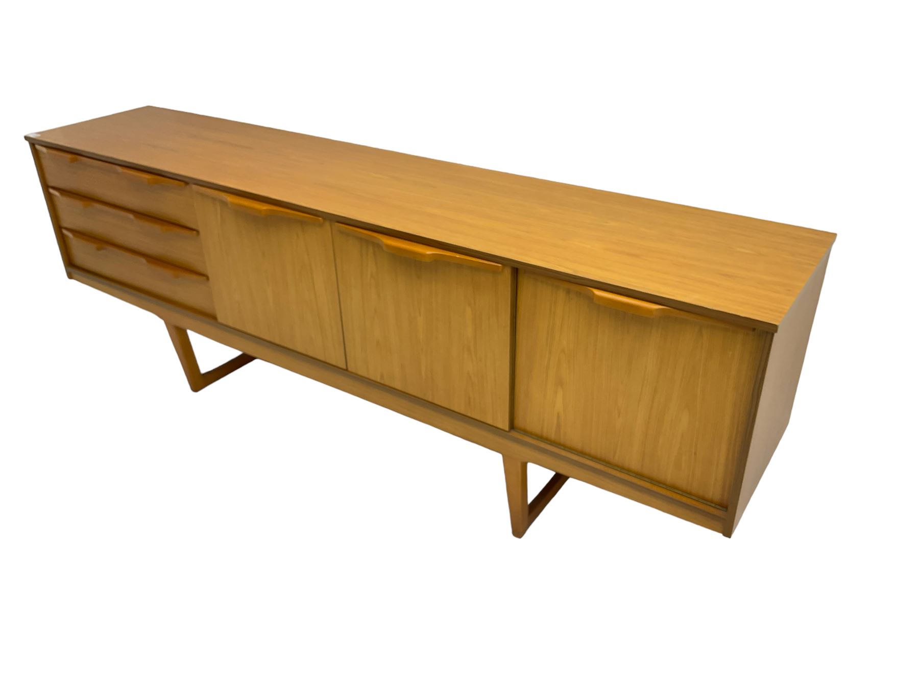 Stonehill Furniture (SF) Ltd - mid-20th century teak sideboard, rectangular topover three drawers, two cupboard doors and fall-front drinks cupboard, raised on square tapering supports