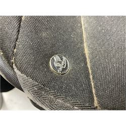 Collection of nine saddles, mainly havana leather to include a racing saddle and a Goodwin saddle, some with stirrups and leathers 