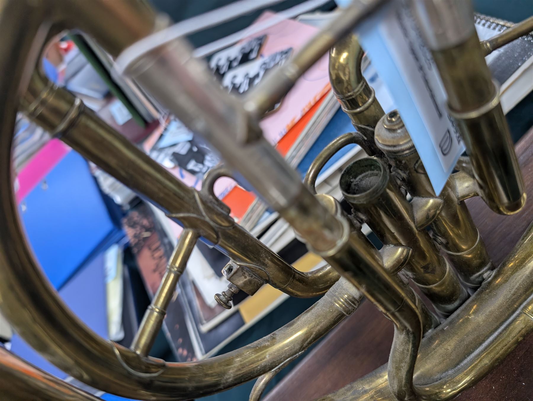 Boosey & Co Ltd French horn, converted into a table lamp, upon a wooden plinth, H45cm