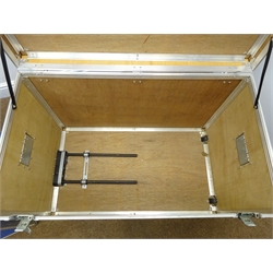  Pair of flight cases, hinged lid with clasps, two side and one extending handle, two side wheels, W96cm, H65cm, D56cm  
