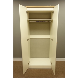  Cream and oak finish two door wardrobe with shelf and hanging space to interior, W74cm, H184cm, D53cm  