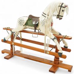 Antony Shackleton of Snainton - 1997 rocking horse titled ‘Fred’, the painted dapple grey body with real horsehair mane and tail, green velvet saddle cloth and leather tack, mounted on a pine swing stand with brass fittings