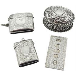 Edwardian silver vesta case, with engraved vacant cartouche and scrolling foliate decoration, hallmarked George Frank Bickerton, Birmingham 1905, together with a further Edwardian silver vesta case with engraved vacant circular panel and shamrock decoration, hallmarked Birmingham 1907, makers mark worn and indistinct, a late Victorian silver trinket box, of oval form with embossed scroll decoration, hallmarked Birmingham 1899, makers mark worn and indistinct, and a modern silver ingot, hallmarked Birmingham 1977, makers mark P.E.B, approximate total silver weight 2.82 ozt (88 grams), (4)
