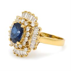 18ct gold sapphire and diamond cluster ring, single oval cut sapphire of approx 2.05 carat, surrounded by two rows of round brilliant cut and baguette cut diamonds, Sheffield import mark 1994, total round cut diamond weight approx 0.55 carat