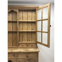 Traditional pine dresser fitted with three drawers and four cupboard doors, complete with glazed display plate rack, W183cm, D49cm, H208cm