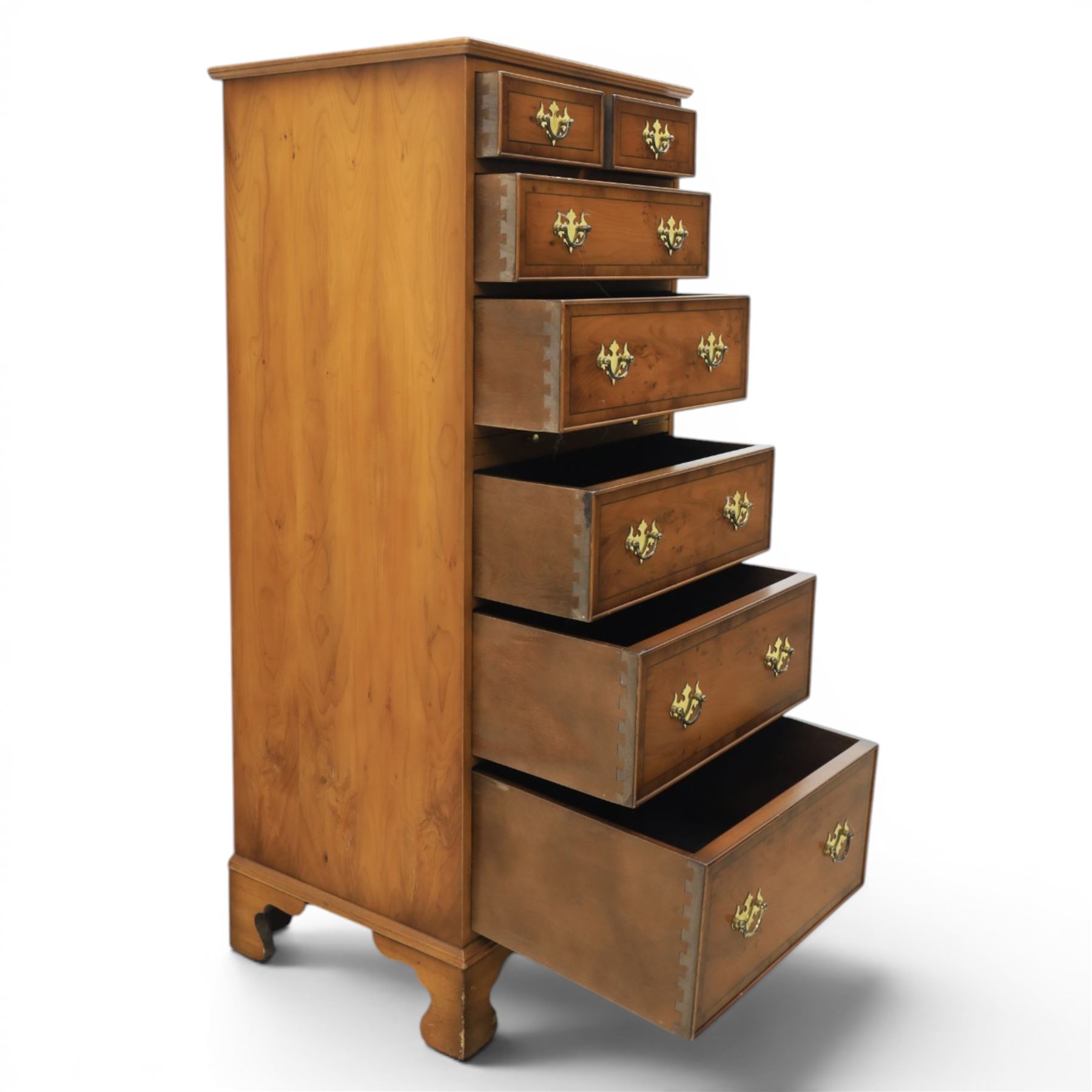 Georgian design yew wood pedestal chest, fitted with seven drawers and slide, brass drop handles