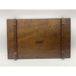 Arts and Crafts oak stand by Arthur Simpson of Kendal, of rectangular form with central hammered pewter panel, surrounded by a border with carved foliate corners, upon two bar supports, bearing label detailed 