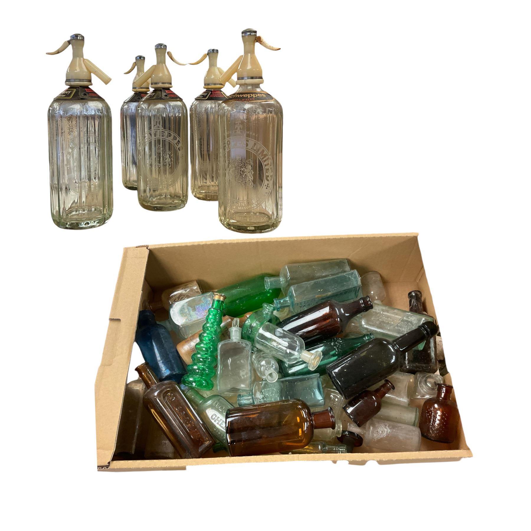 Five Schweppes soda water bottles, together with other vintage glass bottles 