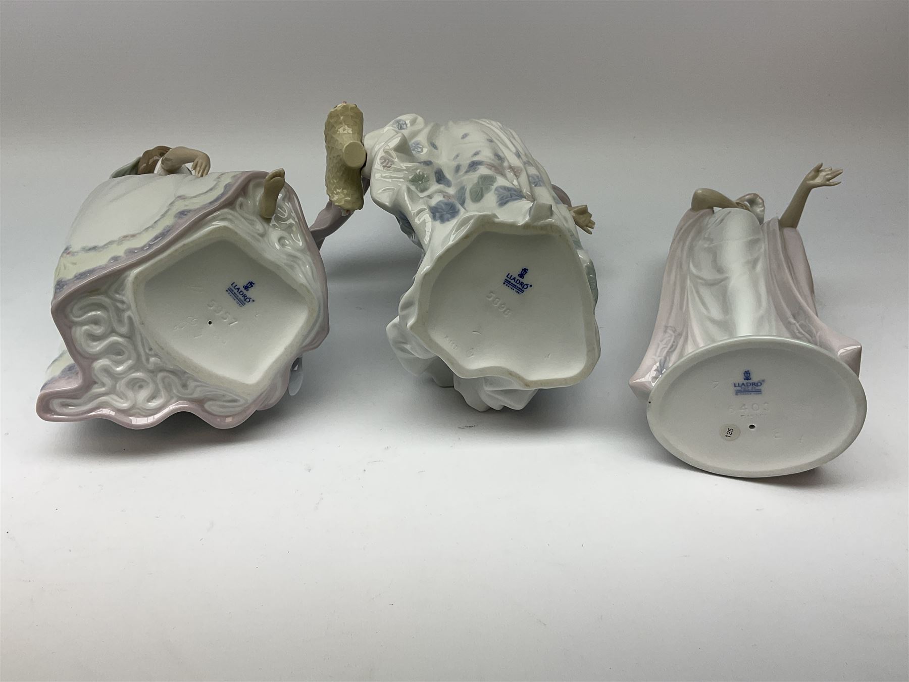 Large Lladro Figures, Spring Splendor, designed by Regino Torrijos, model number 5898, H30.5cm, the glass slipper, designed by Jose Puche, model number 5957, H29cm and Breathless, designed by Juan Ignacio Aliena, model number 6430, H31cm.