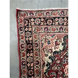 Persian Mahal rug, red ground with overall floral design, interlacing foliage and stylised flower heads, repeating guarded border