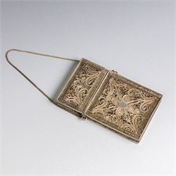 Early 20th century silver coin purse, with floral decoration and finger chain, hallmarked together with an early 20th century cigarette case,  with engraved initials, hallmarked and a silver filigree cigarette case