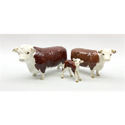 A Beswick Hereford family group, comprising bull 'Ch of Champion' model no 1363, cow 'Ch of Champion' model no 1360, and calf, model no 1406. 