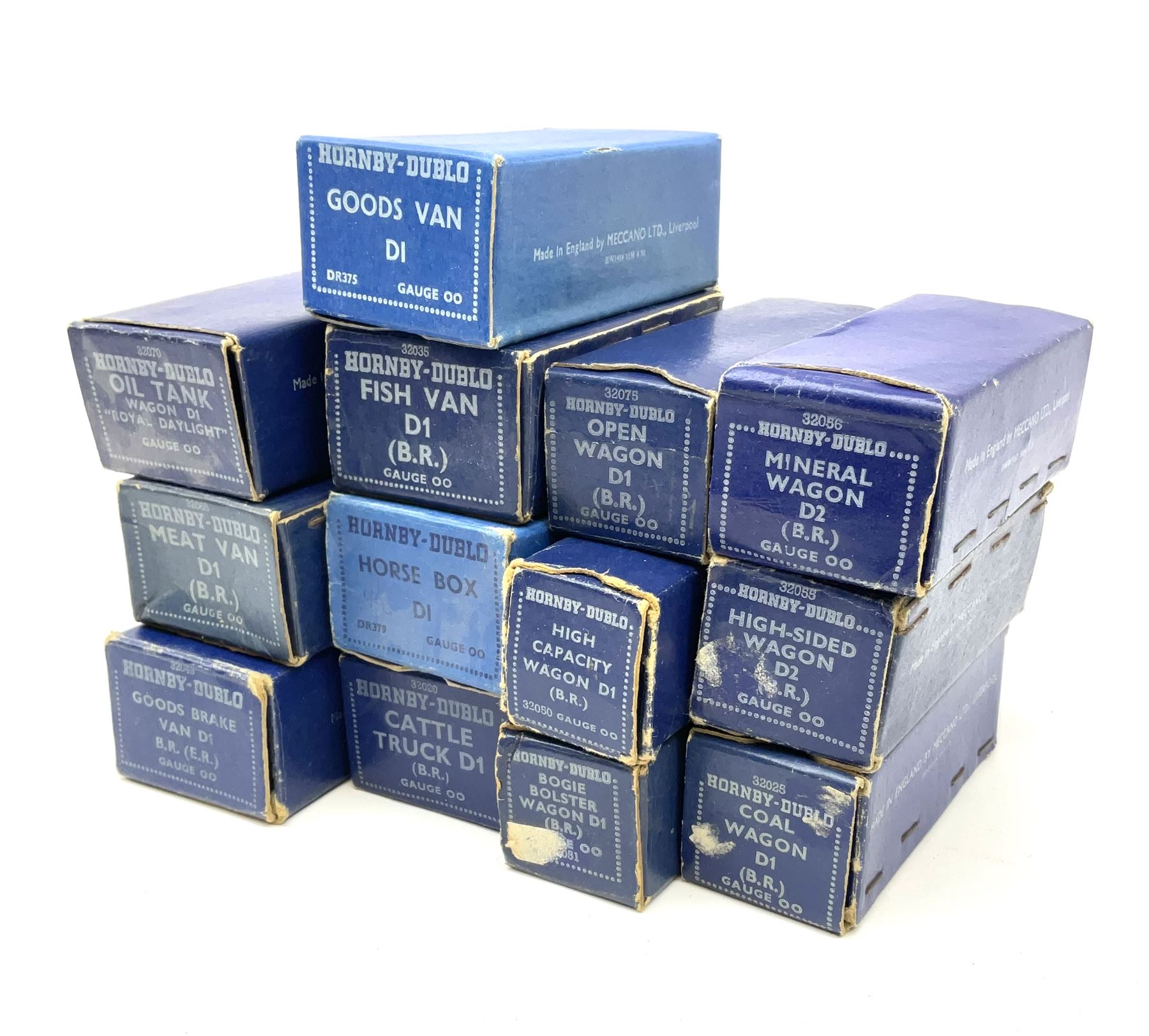 Hornby Dublo - thirteen D1/D2 wagons comprising High Capacity Wagon; Bogie Bolster Wagon; Horse Box; Oil Tank Wagon 'Royal Daylight'; Meat Van; Cattle Truck; Open Wagon; Coal Wagon; Fish Van; Goods Van; Goods Brake Van; Mineral Wagon; and High Sided Wagon; all in dark blue boxes (13)