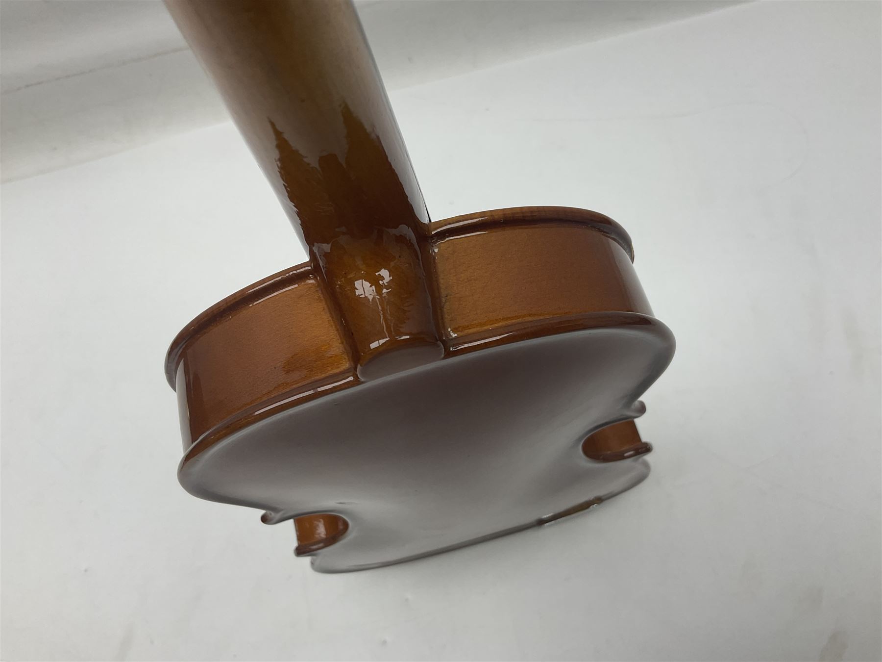 Four Chinese graduated violins - full size with 35.5cm two-piece back; three-quarter size with 33.5cm two-piece back; half size with 31cm two-piece back; and quarter size with 27.5cm two-piece back; all cased except full size; one with bow (4)