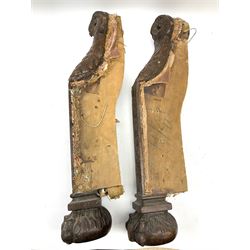 A pair of 20th century carved walnut chair legs/supports, carved with owl masks, fruiting and acanthus detail, and paw feet, H58cm. 